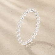 Studio angle view of the 8mm clear quartz bracelet