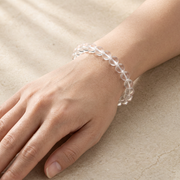 8mm clear quartz bracelet worn on wrist for scale