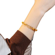Golden tiger eye crystal bracelet shown at natural wrist scale