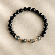Top-down view of the obsidian and green phantom bracelet